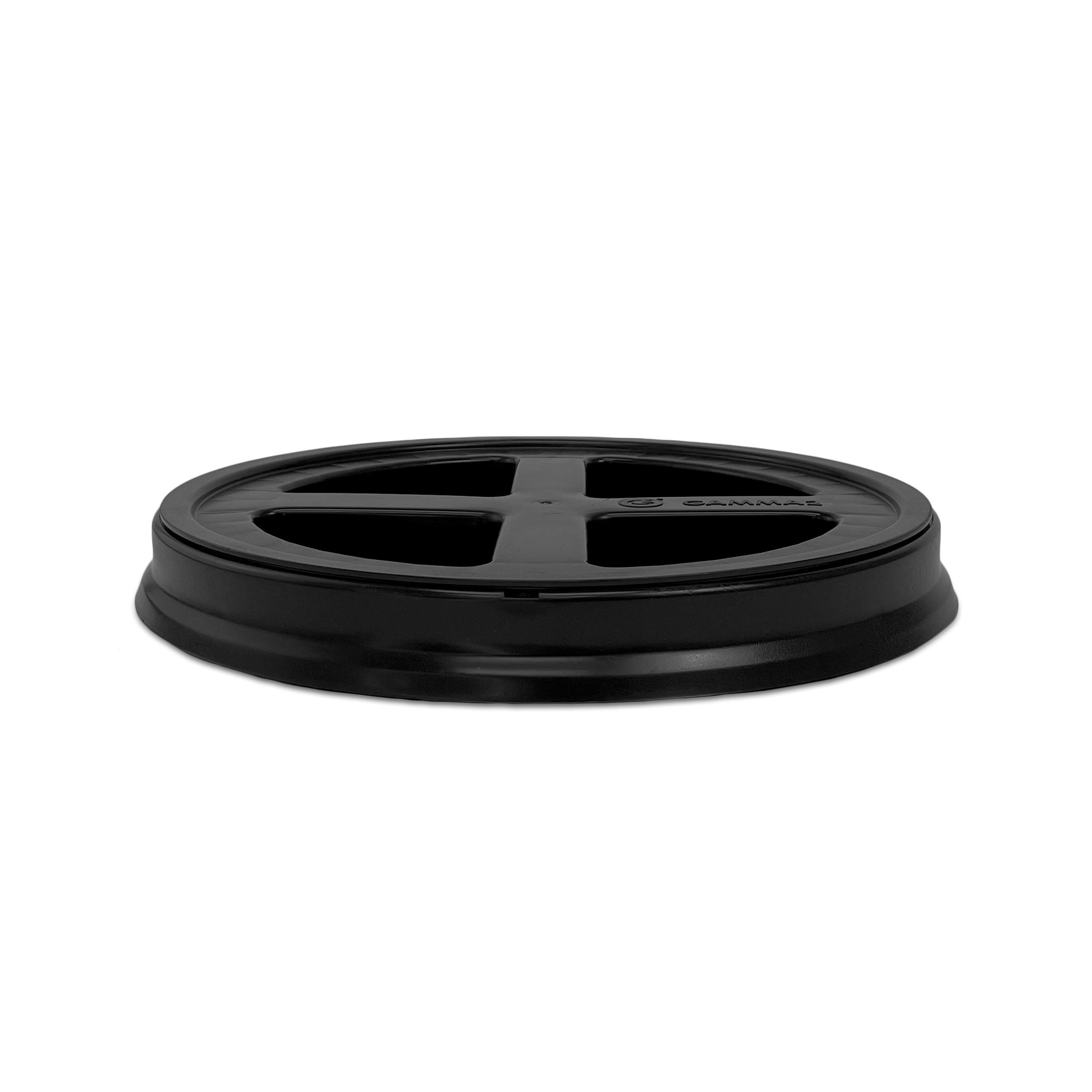 A BPA-free, food-grade Gamma Seal lid for 3.5, 5, and 7 gallon buckets is shown in black plastic with four spokes and a raised rim, photographed on a white background.