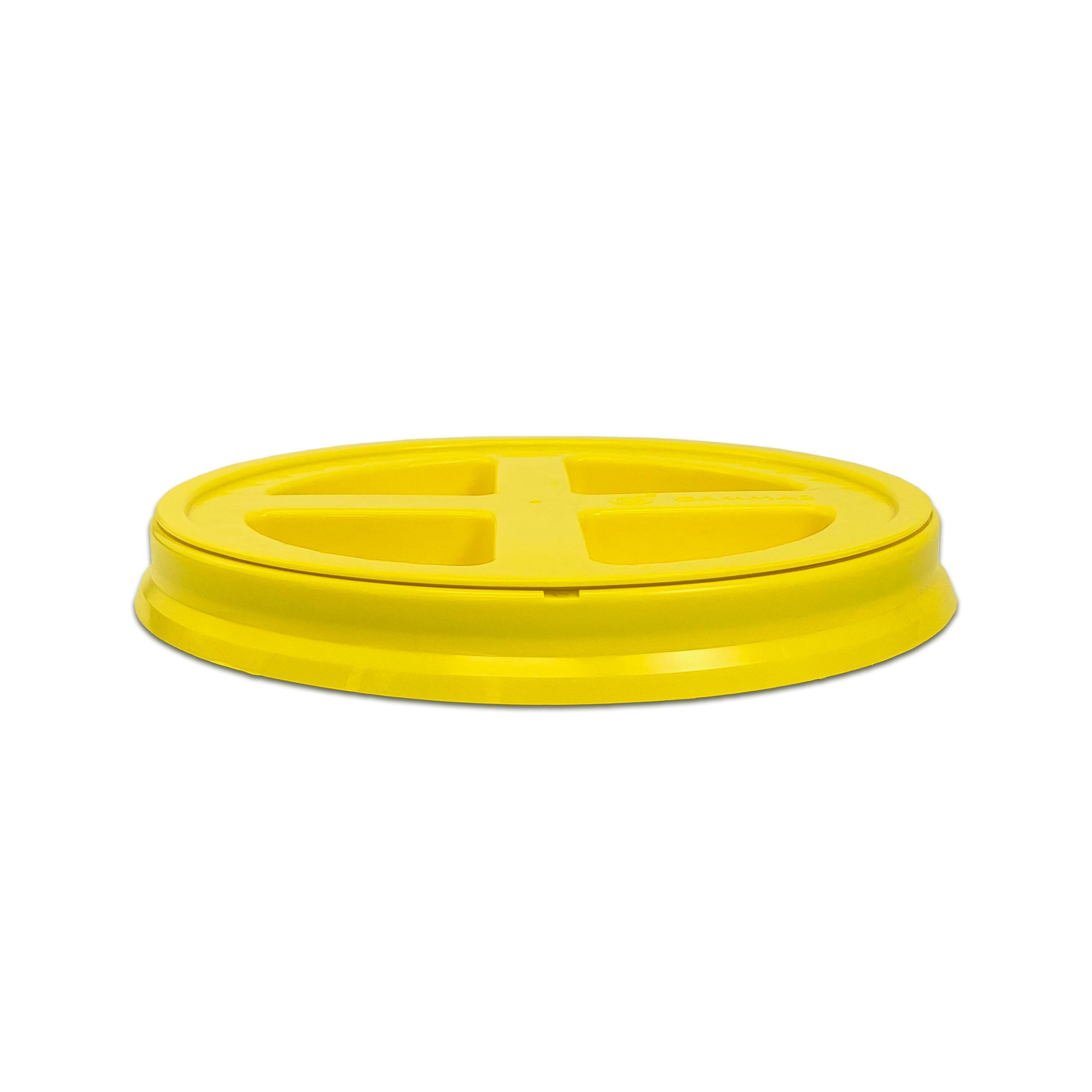 A yellow BPA-free food-grade Gamma Seal lid for 3.5, 5, and 7 gallon buckets with four sections and a raised rim, shown against a white background.